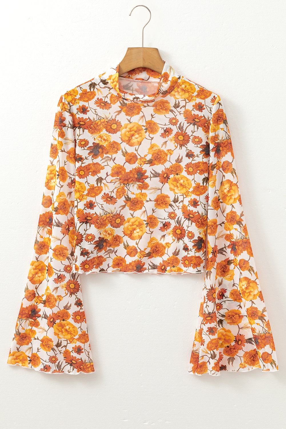 Blusa con estampado floral y manga acampanada