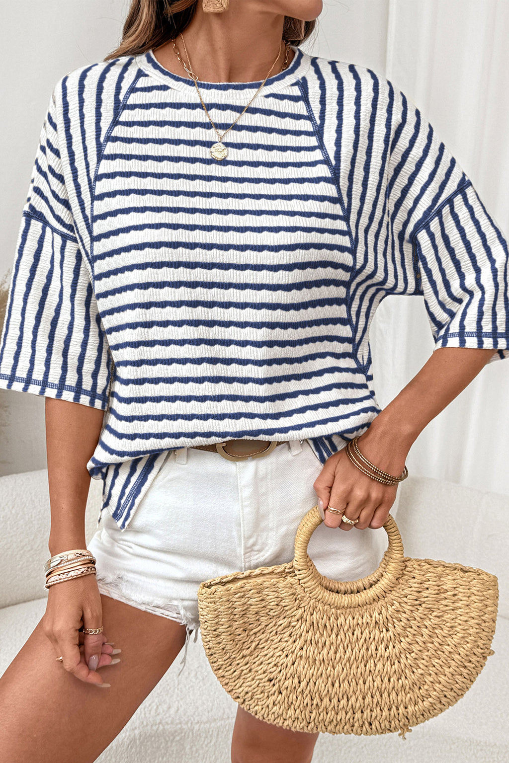 Top holgado de media manga con dobladillo